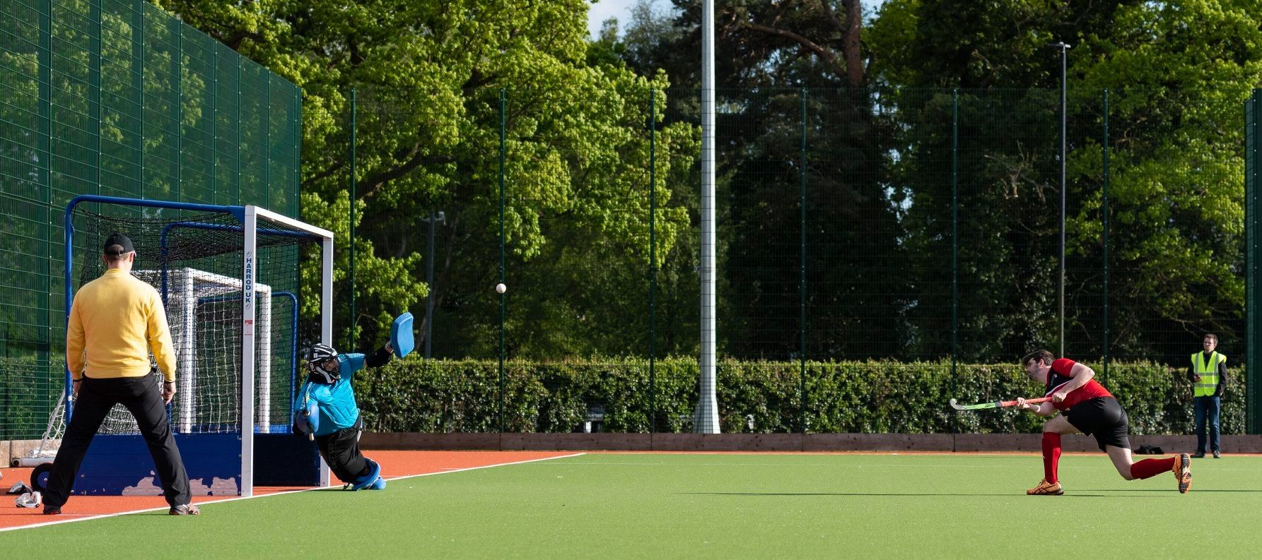 A Lancaster University Hockey player taking a penalty flick during a match.